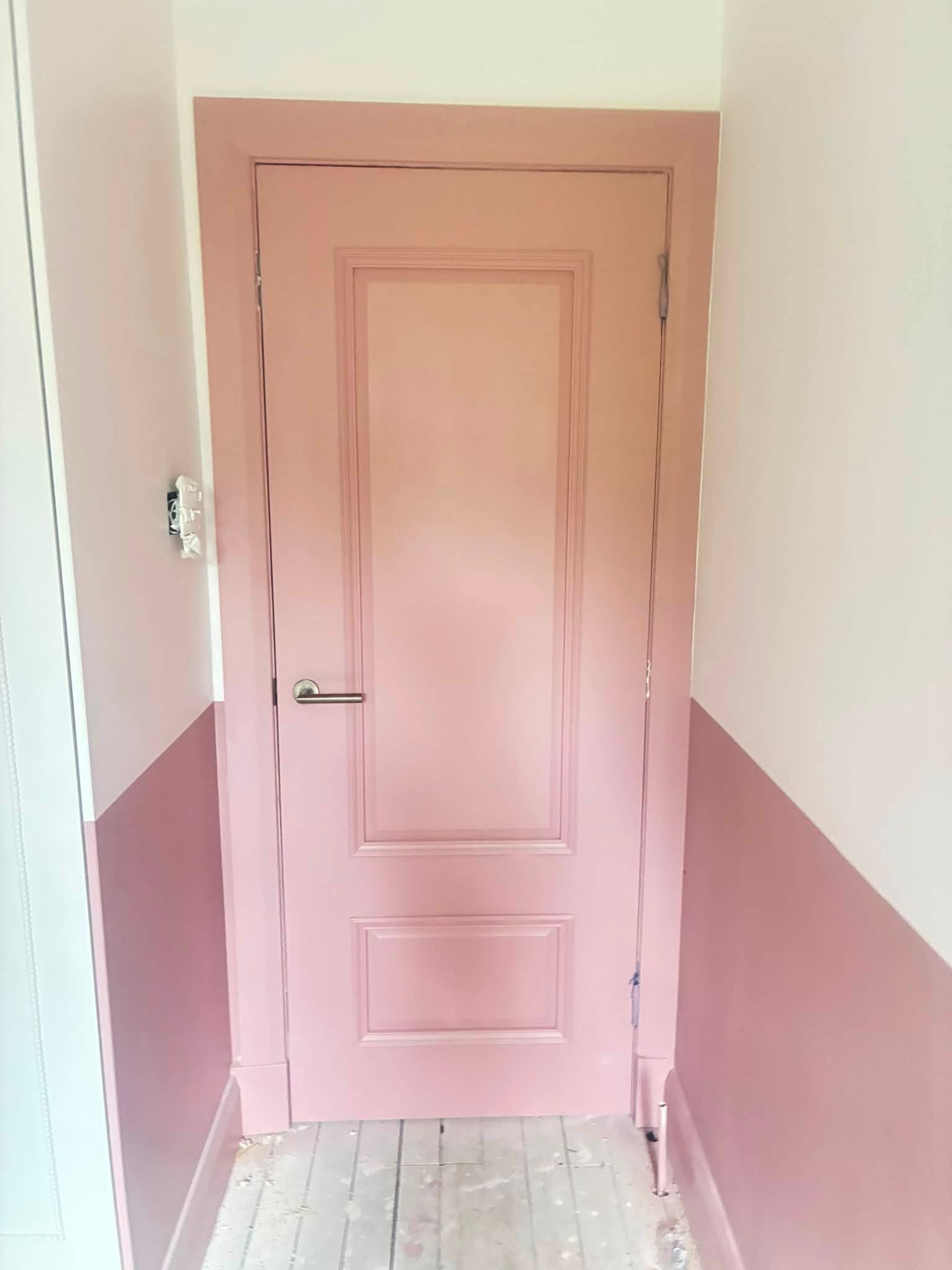 Spray-finished pink panelled door with matching lower walls